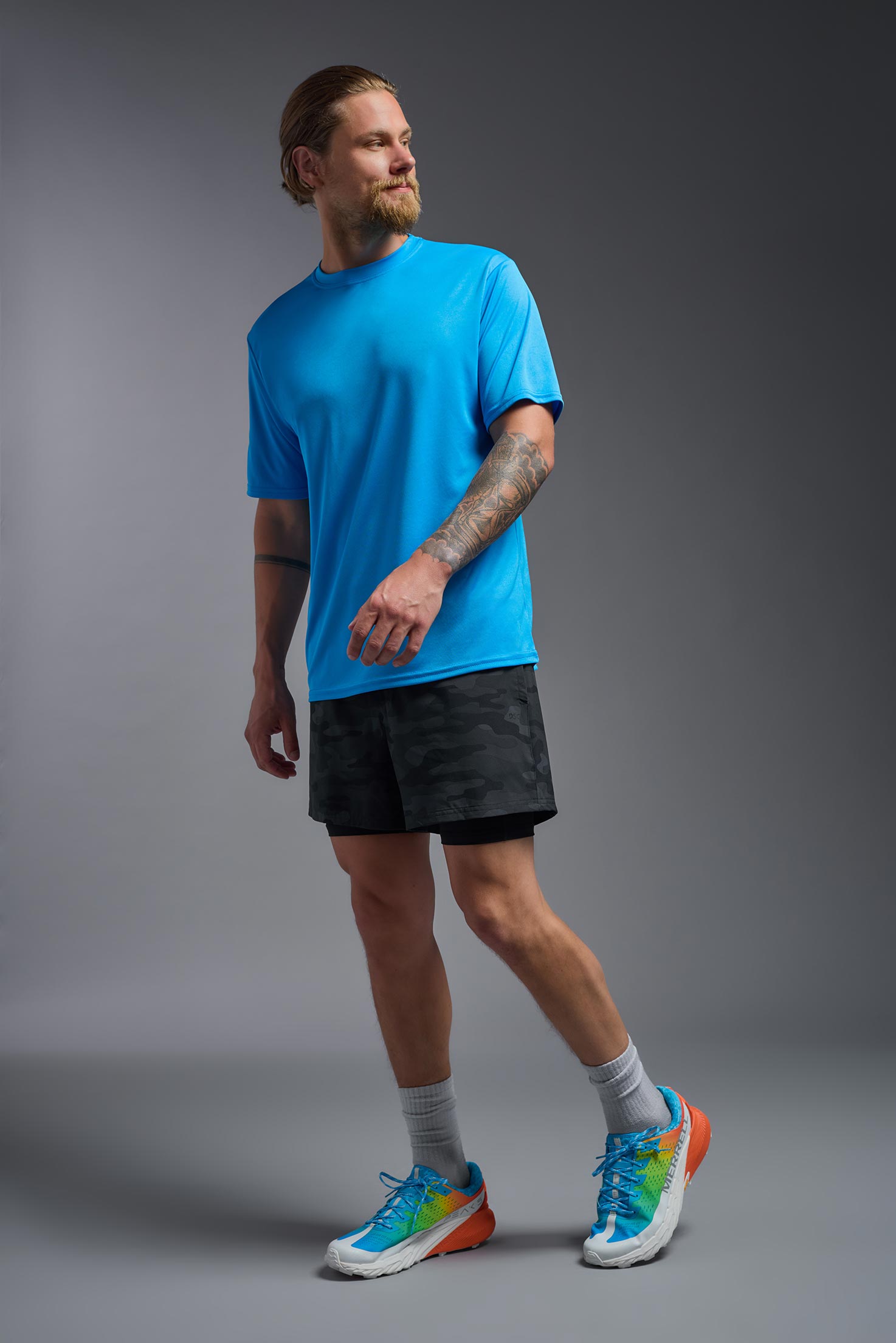 A male model wearing the men's DriMax Expert Tee in safety blue, made out of 100% polyester, showing the relaxed fit from a front view. #safety-blue