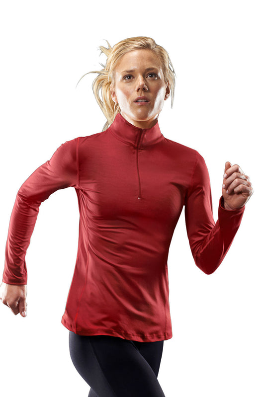 Woman model with blonde hair wearing the 1/4 Zip Pullover Training Top in the color crimson on a white background. This Training top is moisture-wicking and made in the USA #crimson