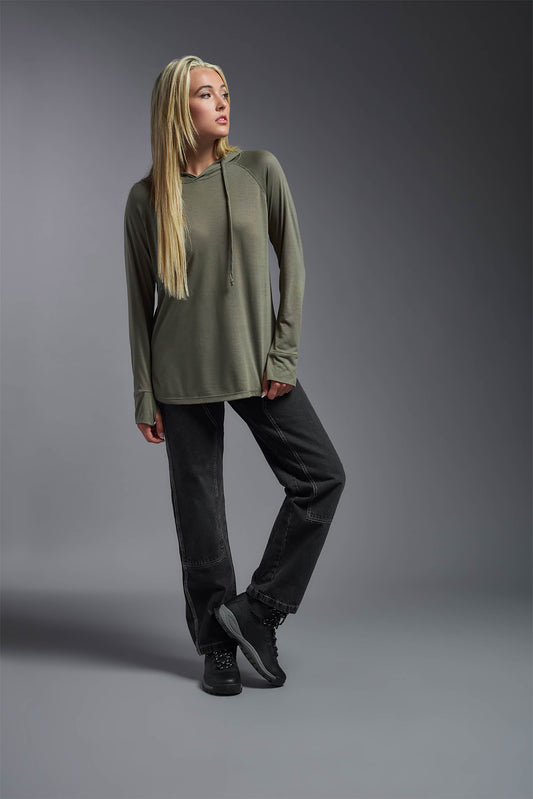 A female model wearing the women's Siro™ Hoodie Shirt in the color olive, made out of 100% filament polyester, showing the relaxed fit from a front view. This long sleeve hoodie shirt is breathable, quick-drying, moisture-wicking, and made in the USA. #olive
