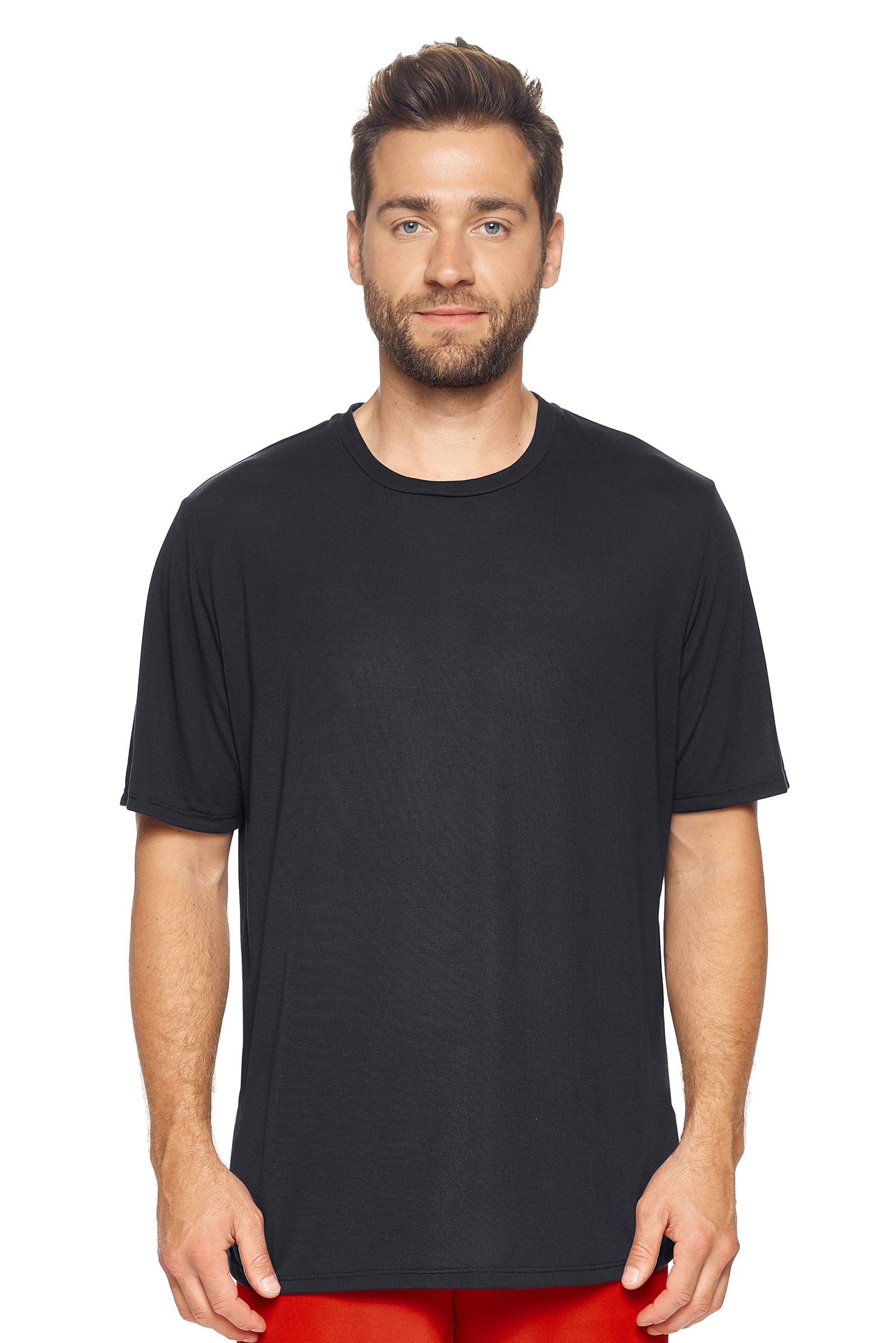 A male model with brown hair wearing the men's Siro™ Crewneck Tee in the color black, made from 100% filament polyester technology, showing the modern fit from a front view. This shirt is elevated and fashion forward while also offering quick-drying and moisture-wicking performance. It is made in the USA, and available for bulk purchase. #black