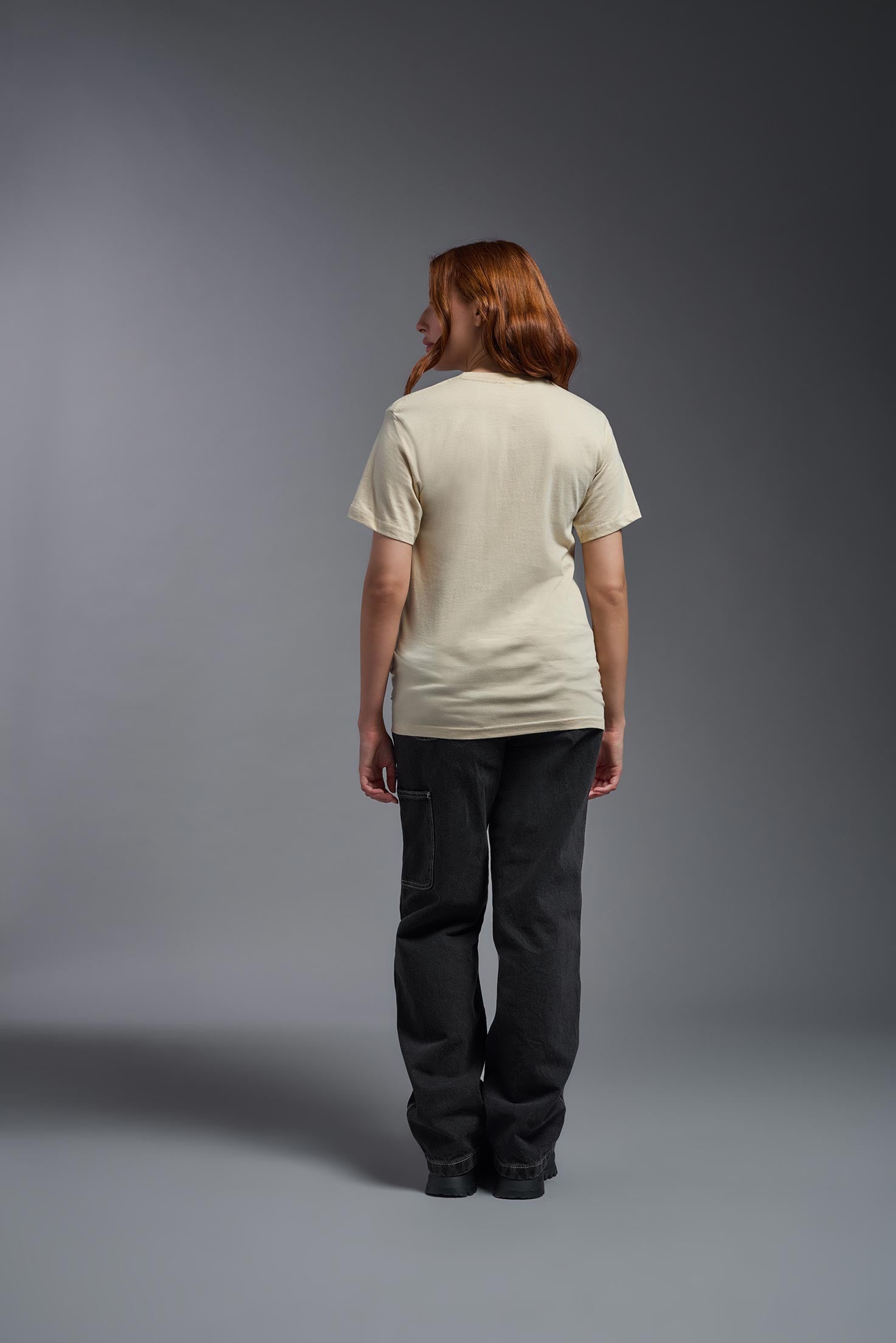 A male and female model wearing the unisex Americana Cotton Soft Tee in the color sand, made from 100% combed ring-spun USA-grown cotton, showing the classic fit from a front view. This premium shirt is Made in the USA. #sand