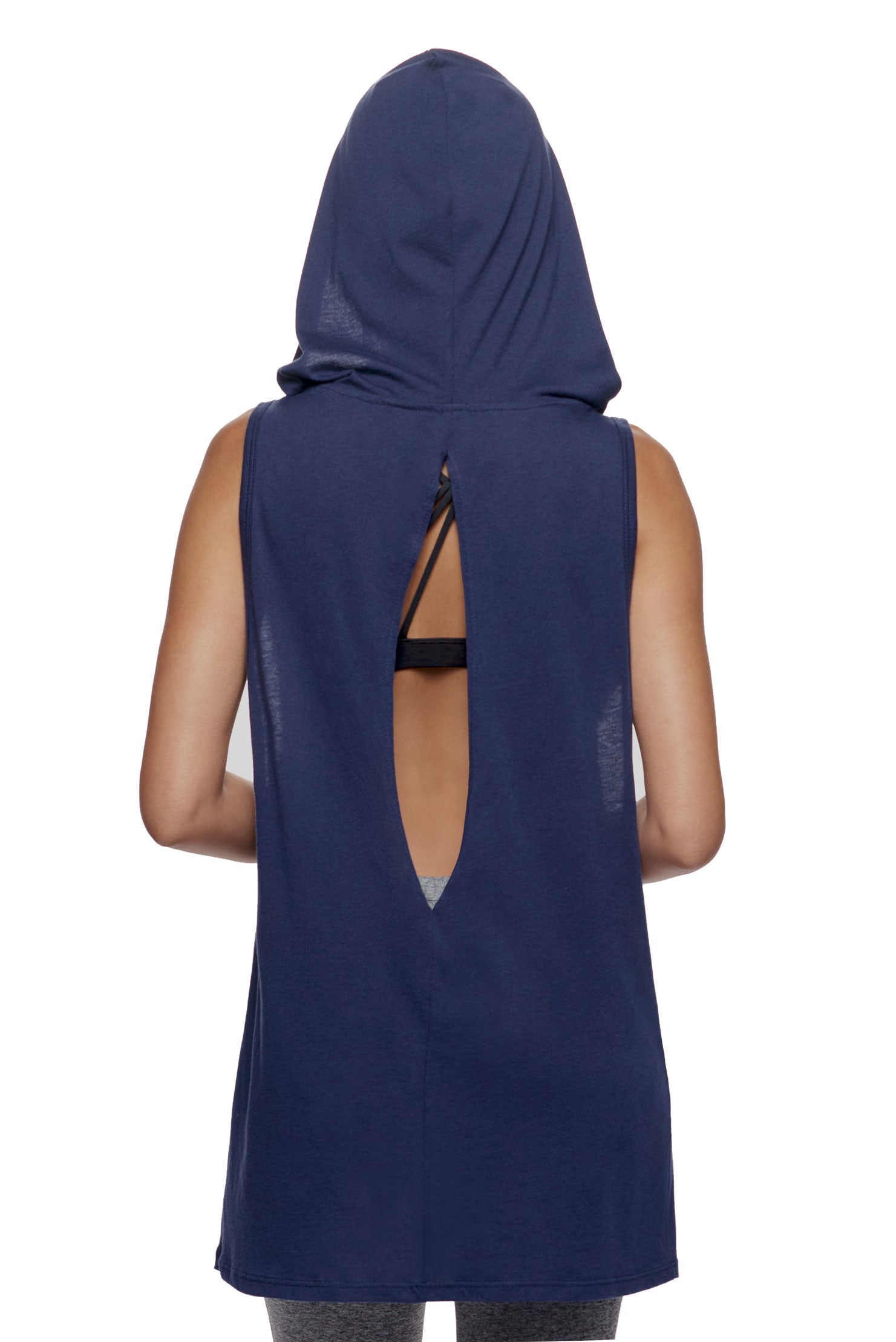 A female model wearing the women's MoCA Sleeveless Hoodie  in the color navy, made from a luxurious blend of 50% LENZING Modal and 50% Cotton, showing the relaxed fit from a back view. This hoodie tank shirt is elevated, eco-friendly, made in the USA, and available for bulk purchase. #navy