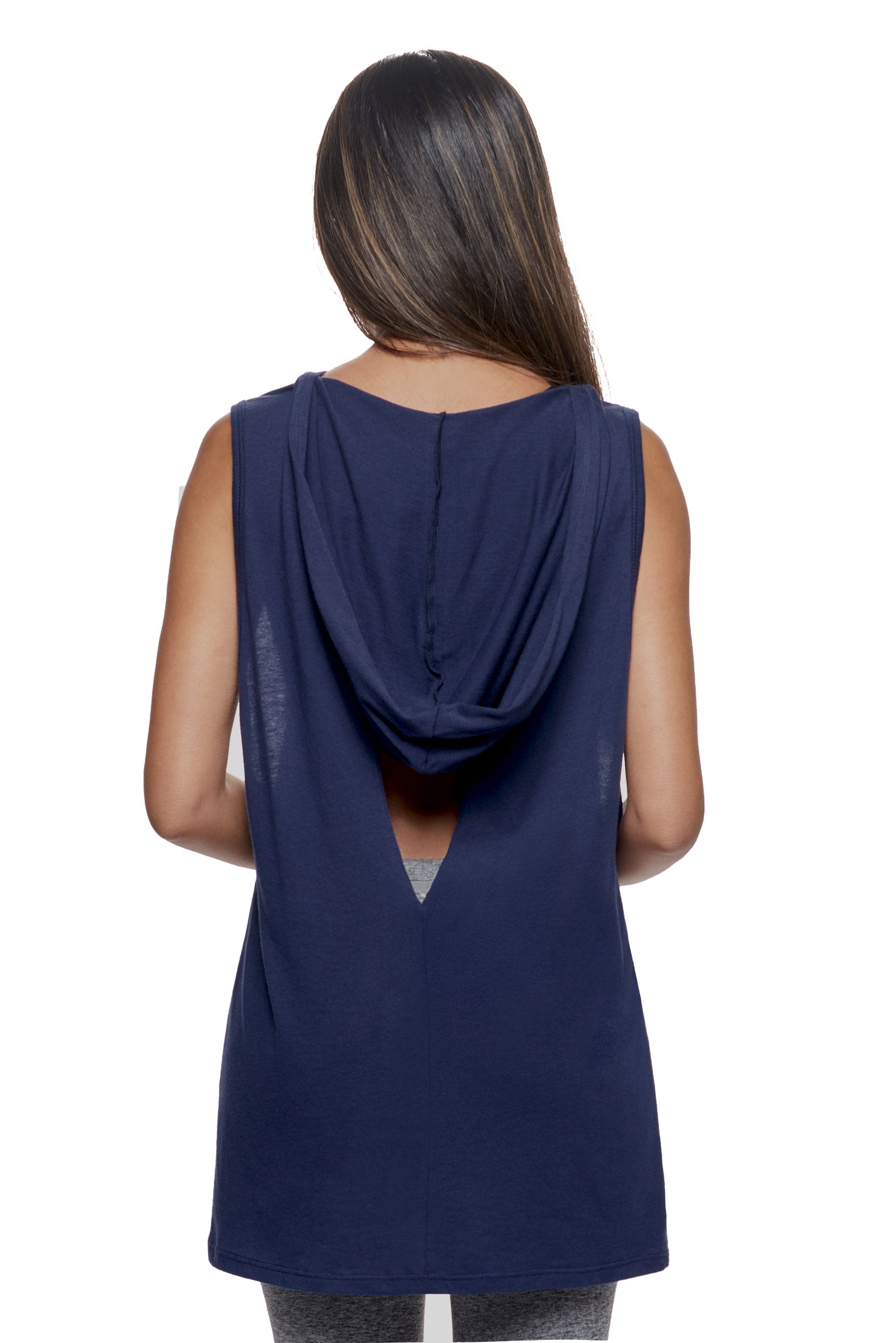 A female model wearing the women's MoCA Sleeveless Hoodie  in the color navy, made from a luxurious blend of 50% LENZING Modal and 50% Cotton, showing the relaxed fit from a back view, hood down. This hoodie tank shirt is elevated, eco-friendly, made in the USA, and available for bulk purchase. #navy