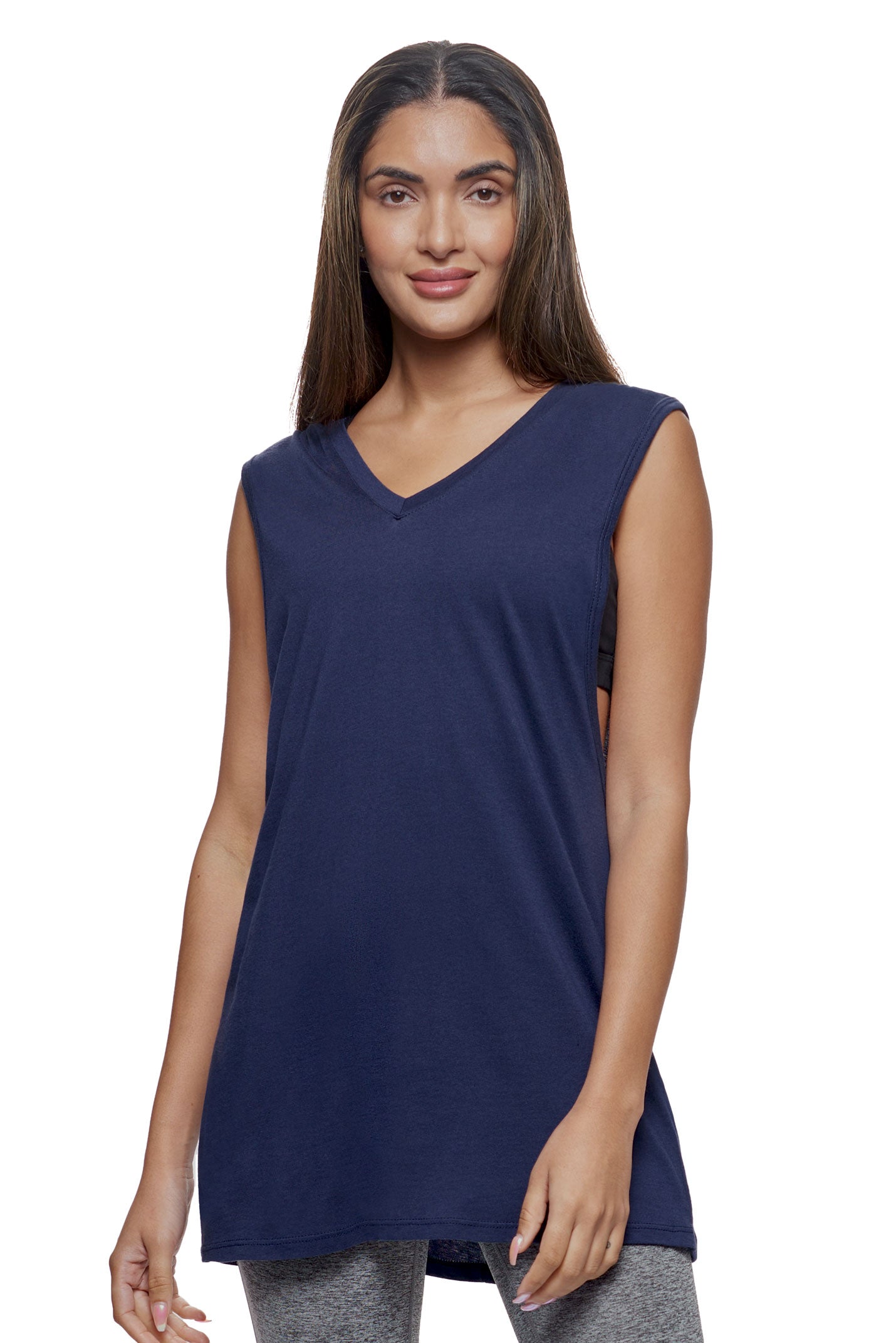 A female model wearing the women's MoCA Sleeveless Hoodie  in the color navy, made from a luxurious blend of 50% LENZING Modal and 50% Cotton, showing the relaxed fit from a front view. This hoodie tank shirt is elevated, eco-friendly, made in the USA, and available for bulk purchase. #navy