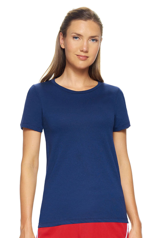 A female model with brown hair wearing the women's MoCA Bay Crewneck Tee in the color navy, made from a luxurious blend of 50% LENZING Modal and 50% Combed Ring-Spun Cotton, showing the relaxed fit from a front view. This shirt is elevated, eco-friendly, made in the USA, and available for bulk purchase. #navy