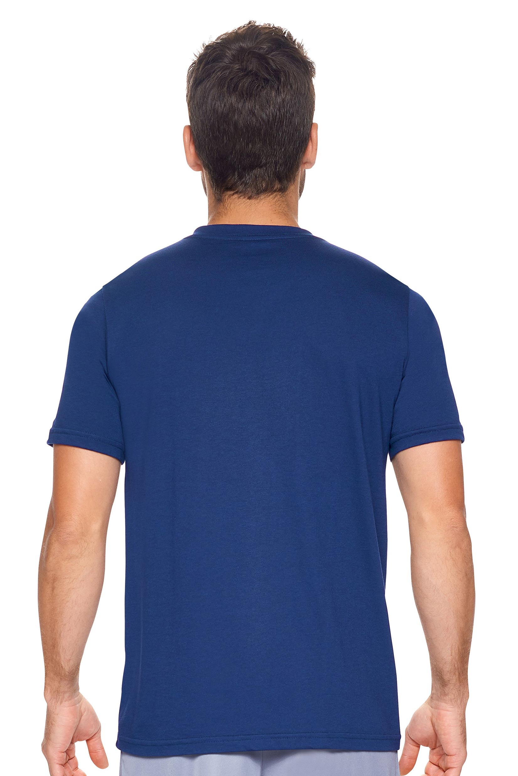 A male model with curly hair wearing the Men's MoCA V-Neck Tee in the color navy, made from a luxurious blend of 50% LENZING Modal and 50% Combed Ring-Spun Cotton, showing the relaxed fit from a back view. This fashion-forward, more sustainable t-shirt is elevated, eco-friendly, made in the USA, and available for bulk purchase. #navy