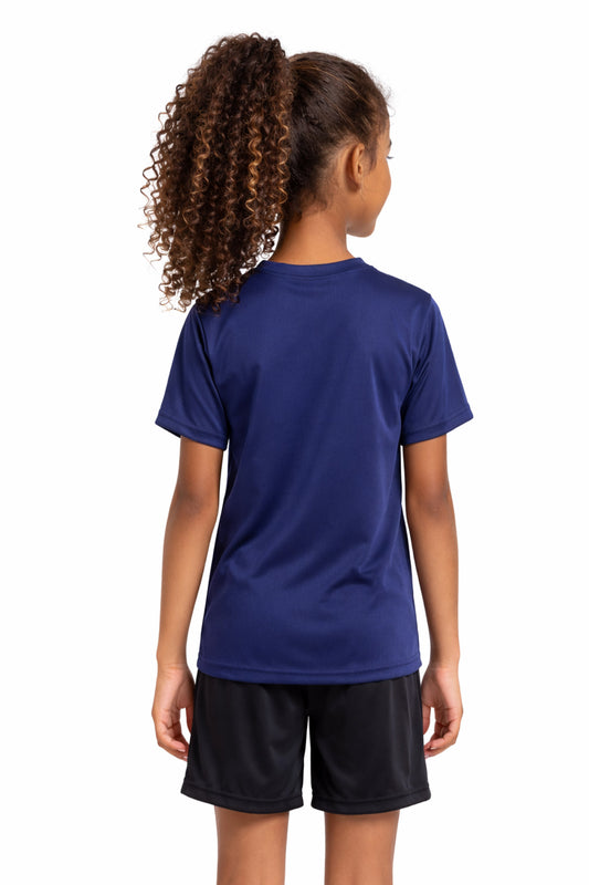 A youth model wearing the youth DriMax Crewneck Expert Tee in the color navy, made out of 100% polyester, showing the relaxed fit from a back view. This shirt wicks sweat, quick-dries, and eliminates odors for up to 30 upf. Made in the USA. #navy