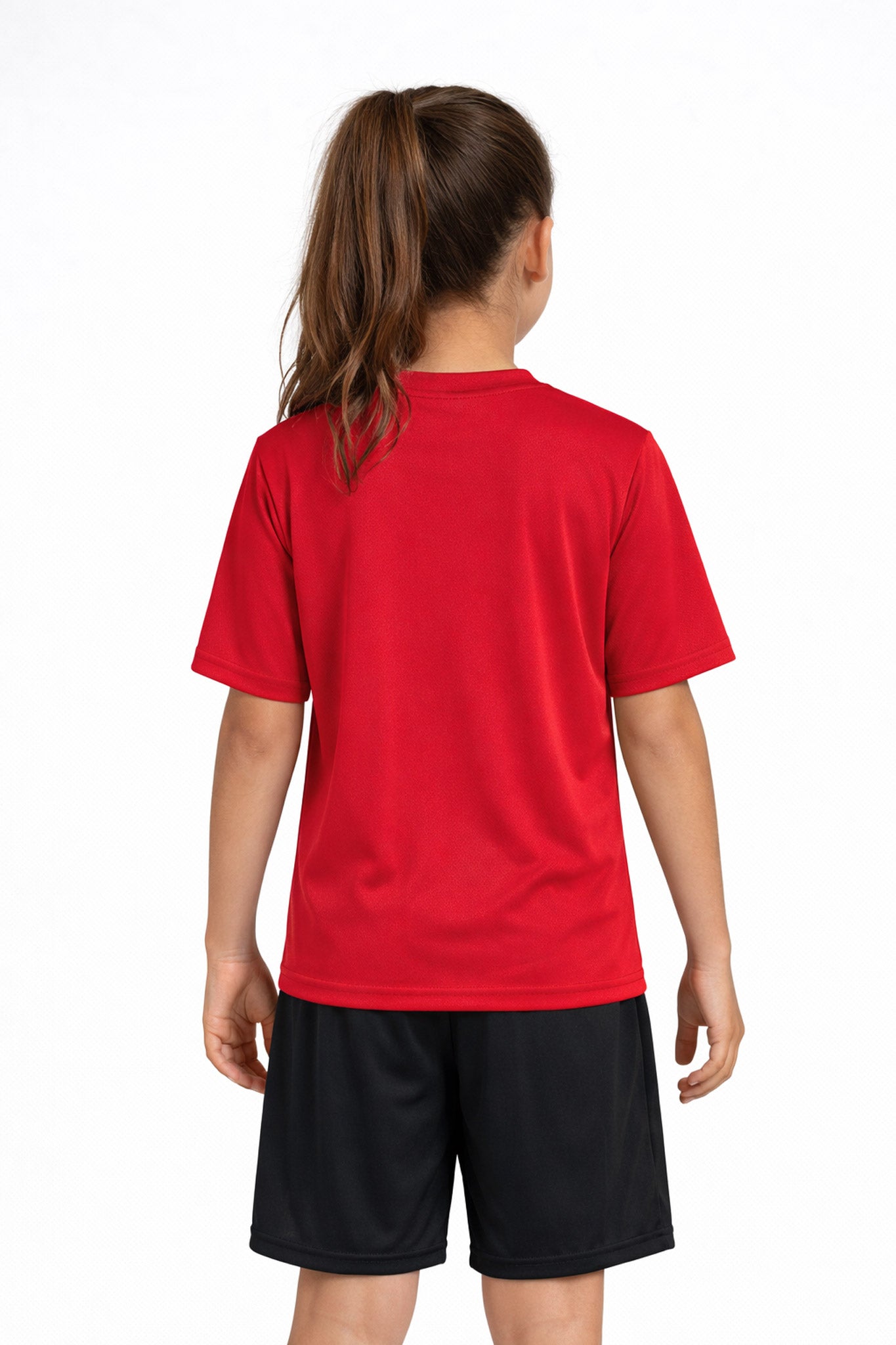 A youth model wearing the youth DriMax Crewneck Expert Tee in the color red, made out of 100% polyester, showing the relaxed fit from a back view. This shirt wicks sweat, quick-dries, and eliminates odors for up to 30 UV protection. Made in the USA. #red