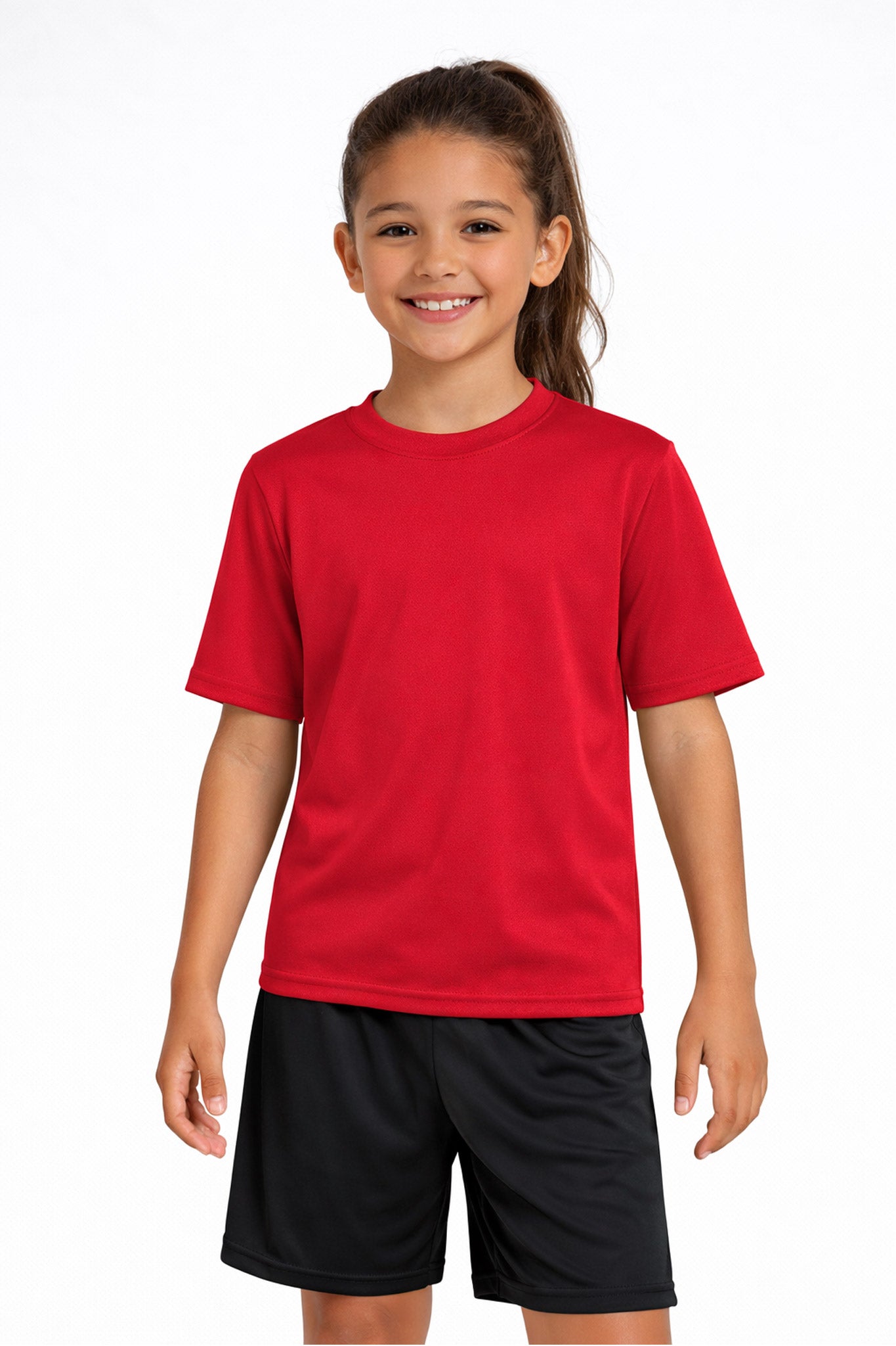 A youth model wearing the youth DriMax Crewneck Expert Tee in the color red, made out of 100% polyester, showing the relaxed fit from a front view. This shirt wicks sweat, quick-dries, and eliminates odors for up to 30 UV protection. Made in the USA. #red