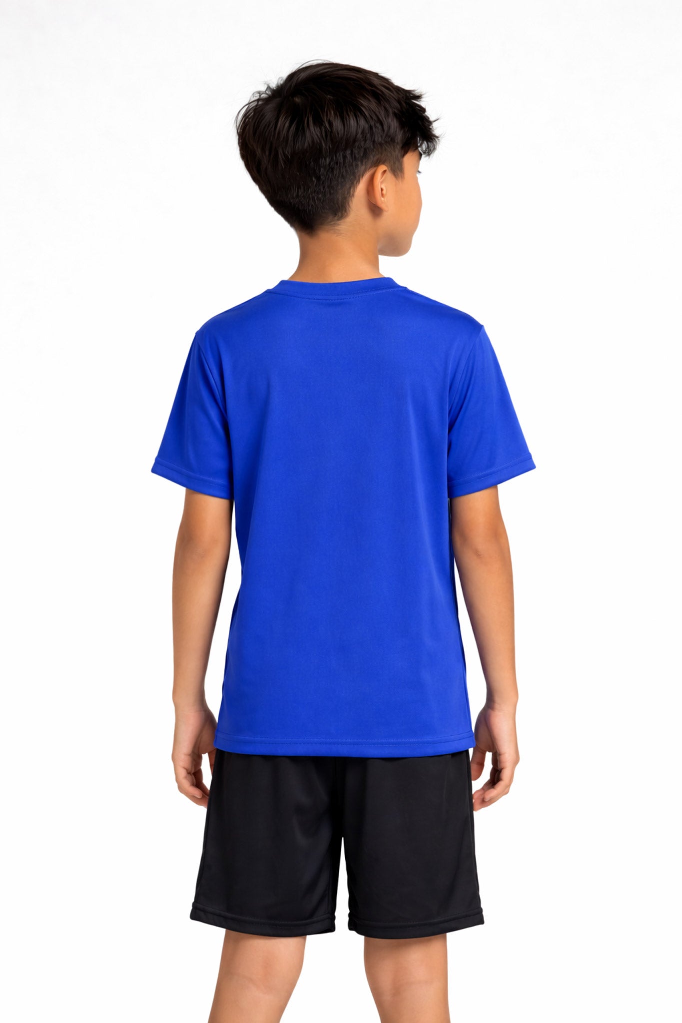 A youth model wearing the youth DriMax Crewneck Expert Tee in the color royal, made out of 100% polyester, showing the relaxed fit from a back view. This shirt wicks sweat, quick-dries, and eliminates odors for up to 30 UV protection. Made in the USA. #royal-blue