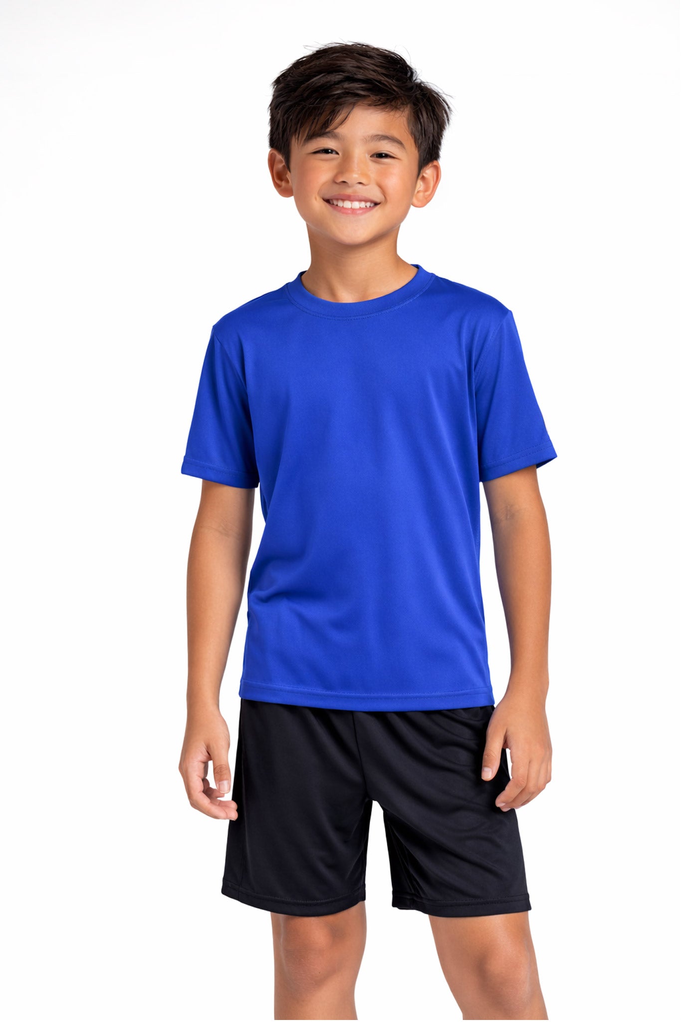 A youth model wearing the youth DriMax Crewneck Expert Tee in the color royal, made out of 100% polyester, showing the relaxed fit from a back view. This shirt wicks sweat, quick-dries, and eliminates odors for up to 30 UV protection. Made in the USA. #royal-blue