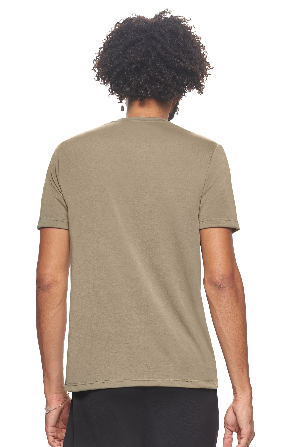 A male model with brown hair wearing the men's Siro™ Crewneck Tee in the color olive, made from 100% filament polyester technology, showing the modern fit from a back view. This shirt is elevated and fashion forward while also offering quick-drying and moisture-wicking performance. It is made in the USA, and available for bulk purchase. #olive
