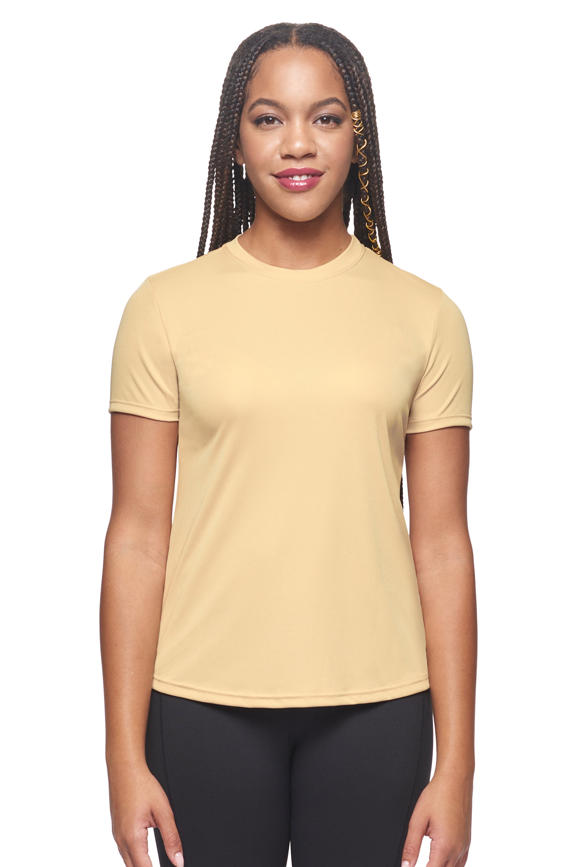 A female model wearing the women's DriMax Crewneck Expert Tee in the color vegas gold, made out of 100% polyester, showing the relaxed fit from a close-up collar view. This shirt is quick-drying, moisture-wicking, offers up to 30 upf protection and is made in the USA. #vegas-gold