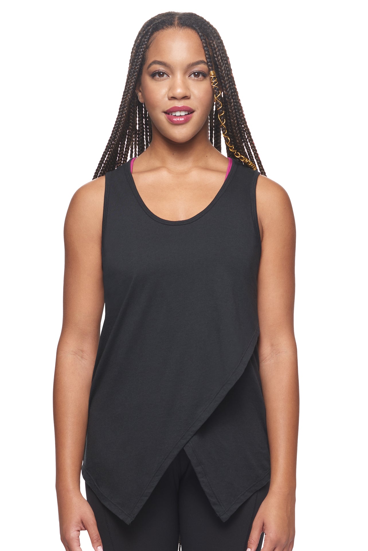 A female model with braided hair wearing the women's MoCA Tie Front Tank Tee in the color black, made from a luxurious blend of 50% LENZING Modal and 50% Combed Ring-Spun Cotton, showing the relaxed fit from a front view. This fashion-forward, more sustainable t-shirt is elevated, eco-friendly, made in the USA, and available for bulk purchase. #black