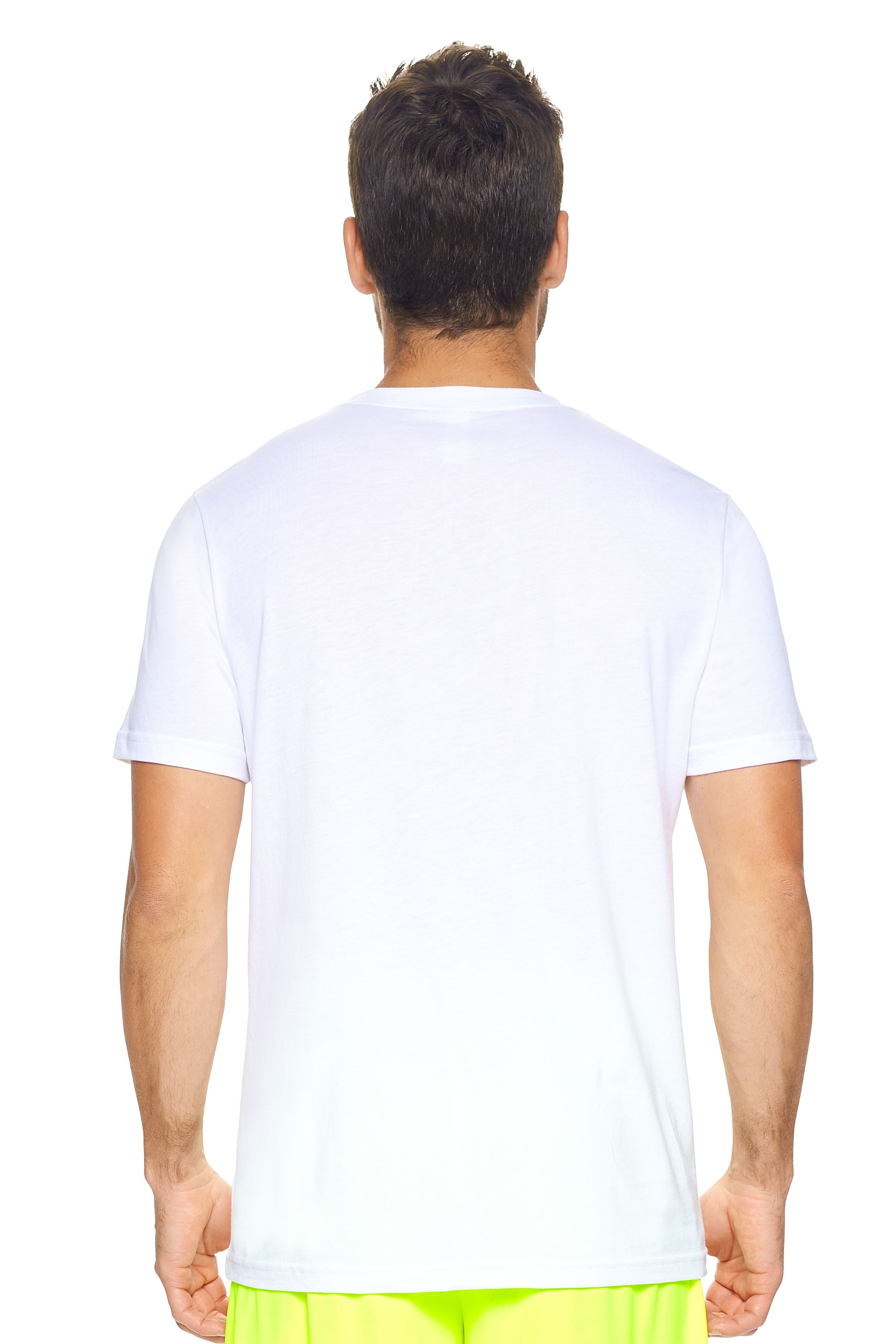 A male model with brown hair wearing the Men's MoCA V-Neck Tee in the color white, made from a luxurious blend of 50% LENZING Modal and 50% Combed Ring-Spun Cotton, showing the relaxed fit from a back view. This fashion-forward, more sustainable t-shirt is elevated, eco-friendly, made in the USA, and available for bulk purchase. #white